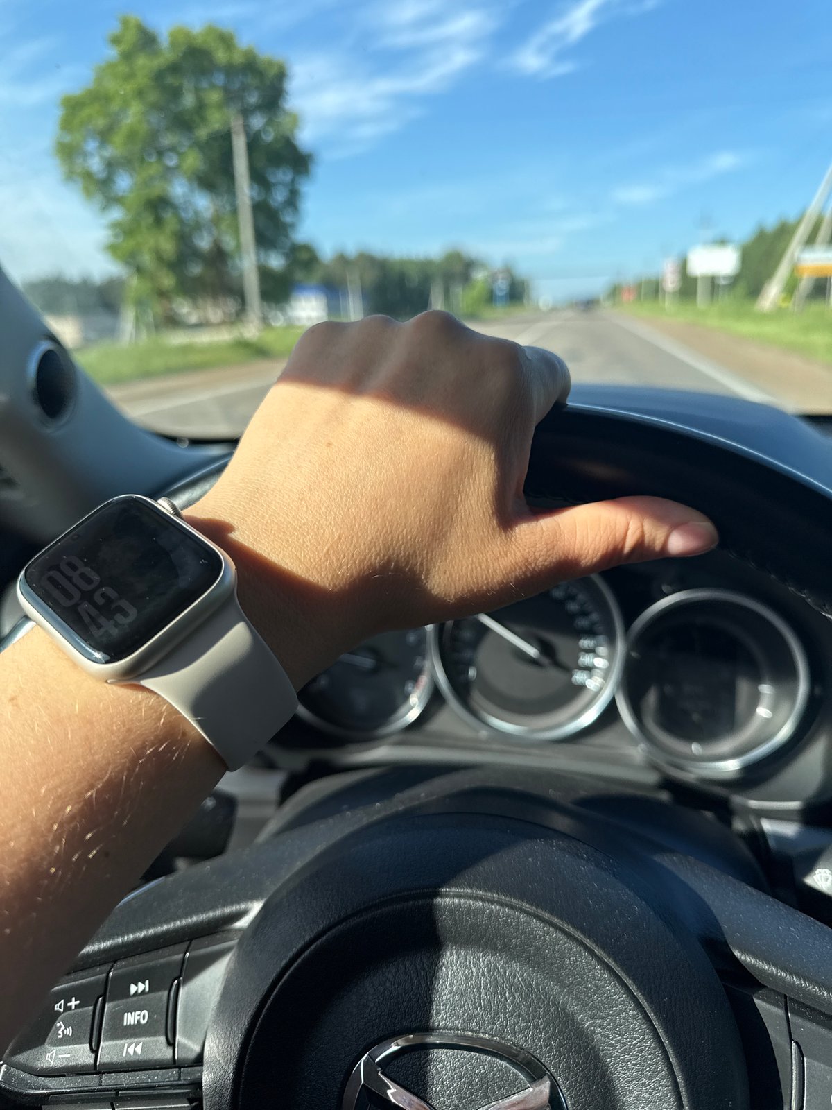 Driver photographed gripping steering wheel in Ольховка, Russia