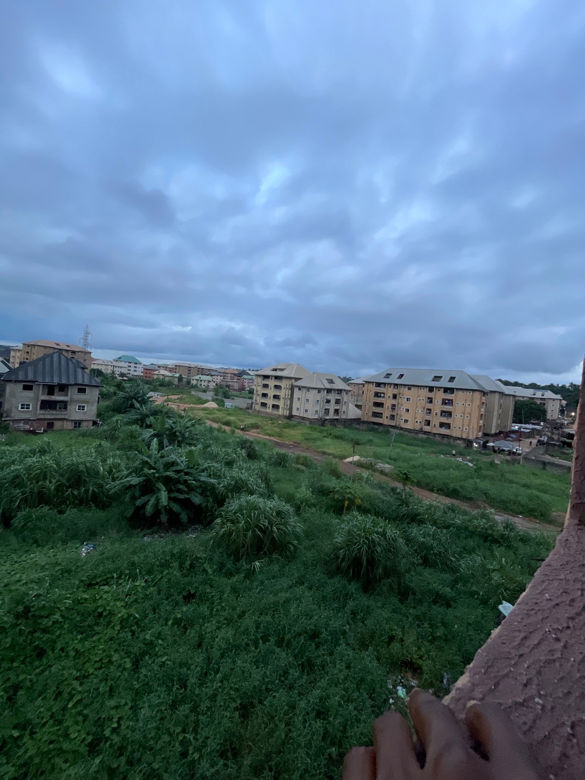 Cloudy afternoon across Nkpor's residential streets and rooftops