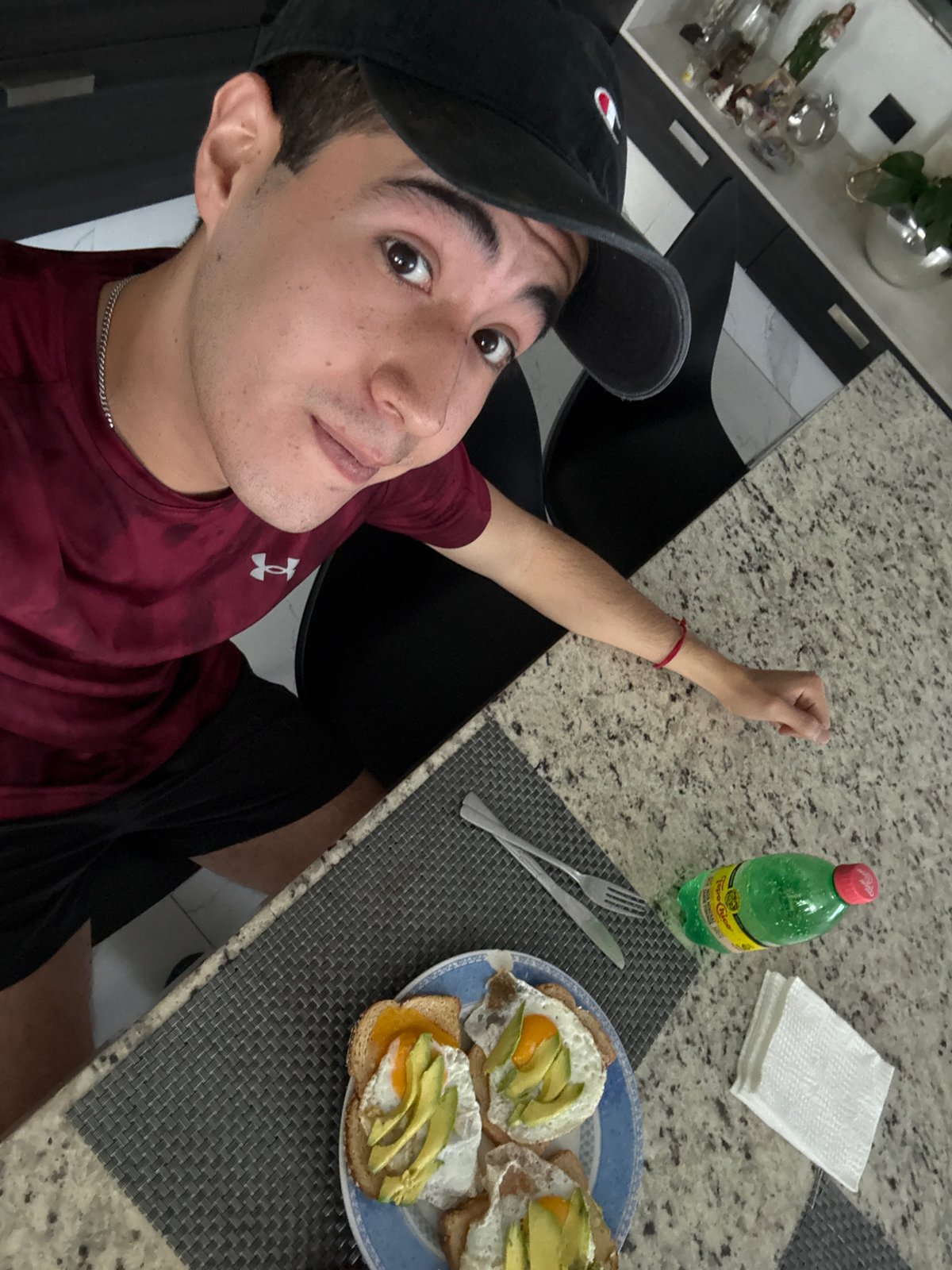 Young man takes selfie with breakfast in Mexico