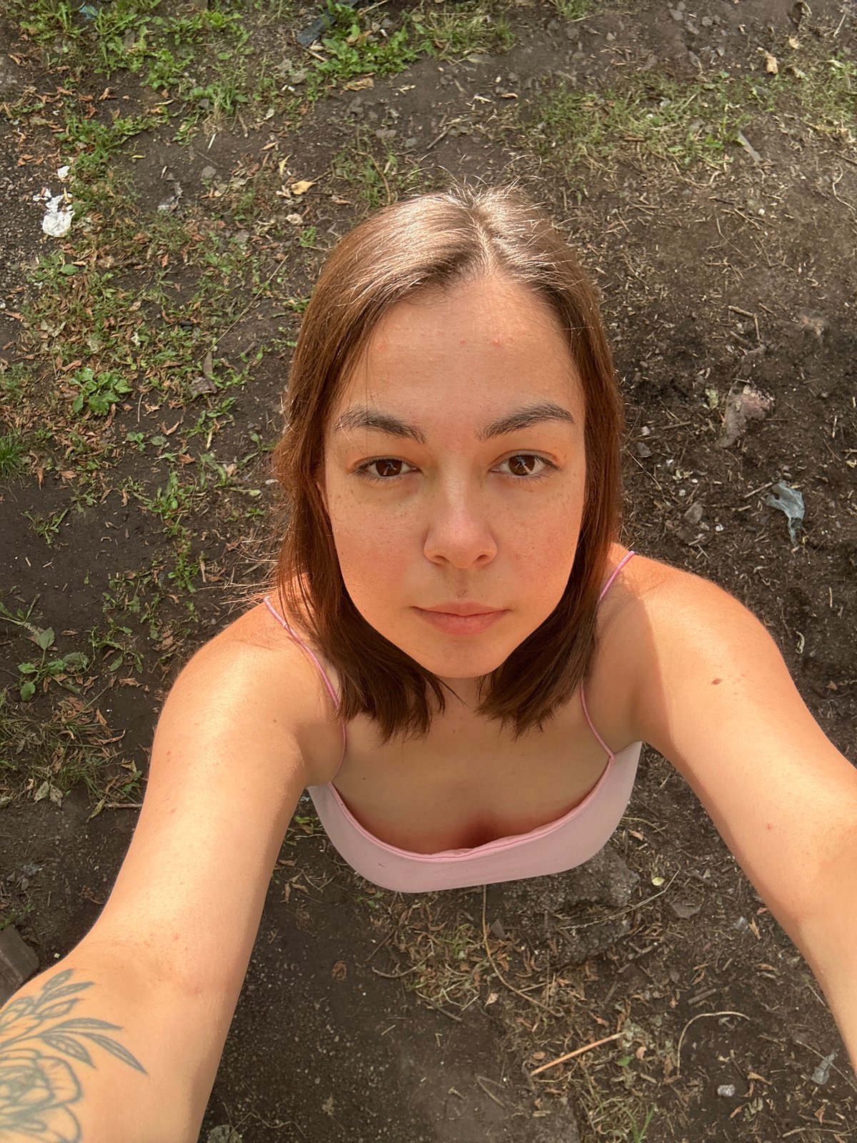 Backyard afternoon in Magnitogorsk: dogs, birch trees, and rustic surroundings