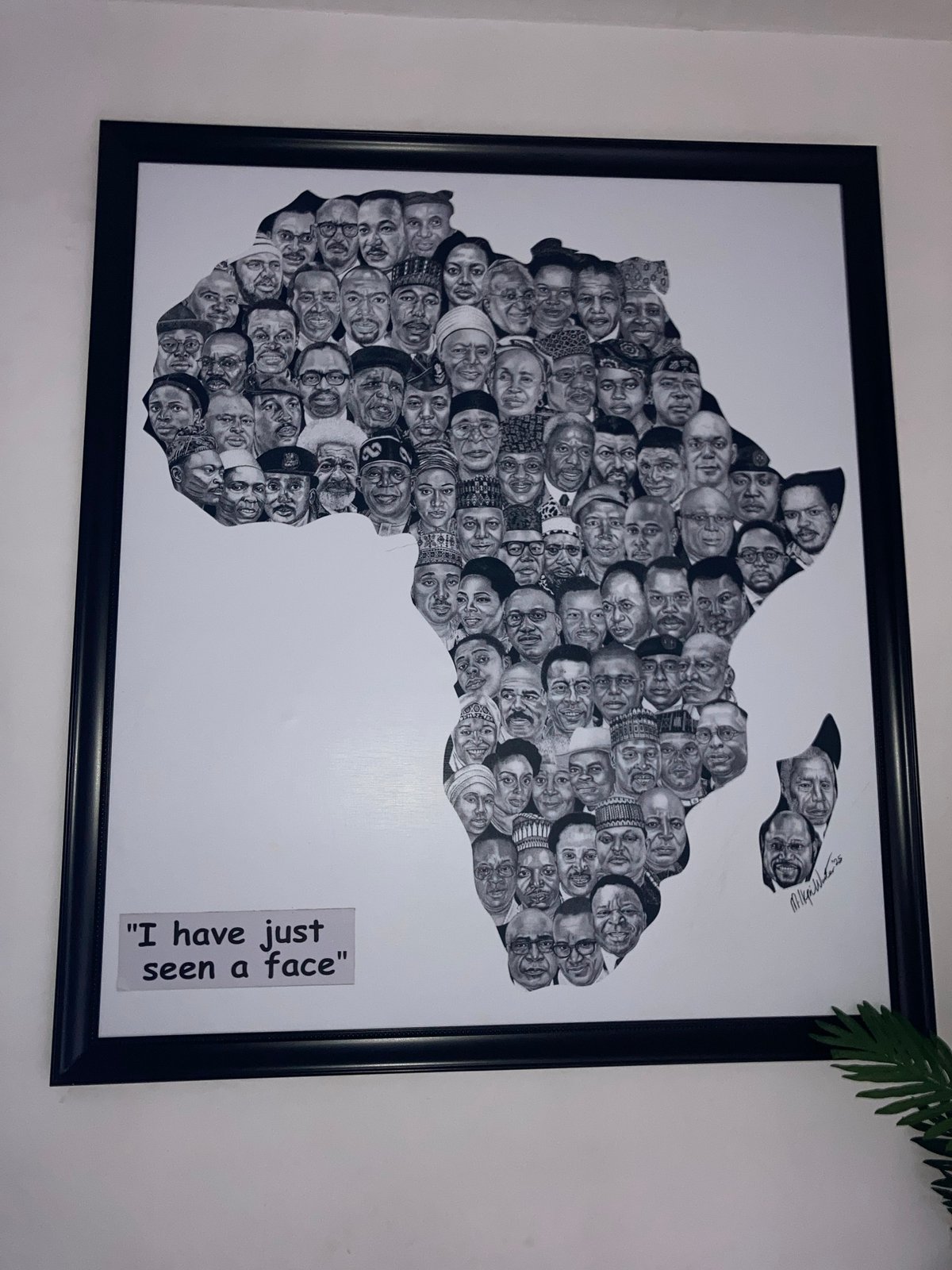 Wall gallery display featuring diverse artwork in Abuja