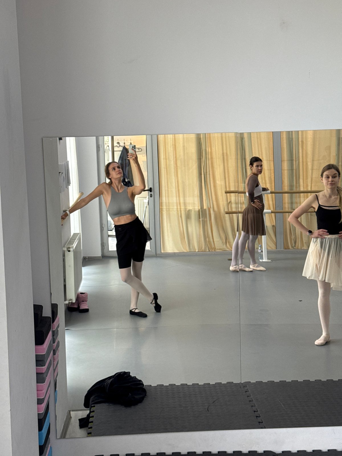 Ballet dancers practice in studio during morning session