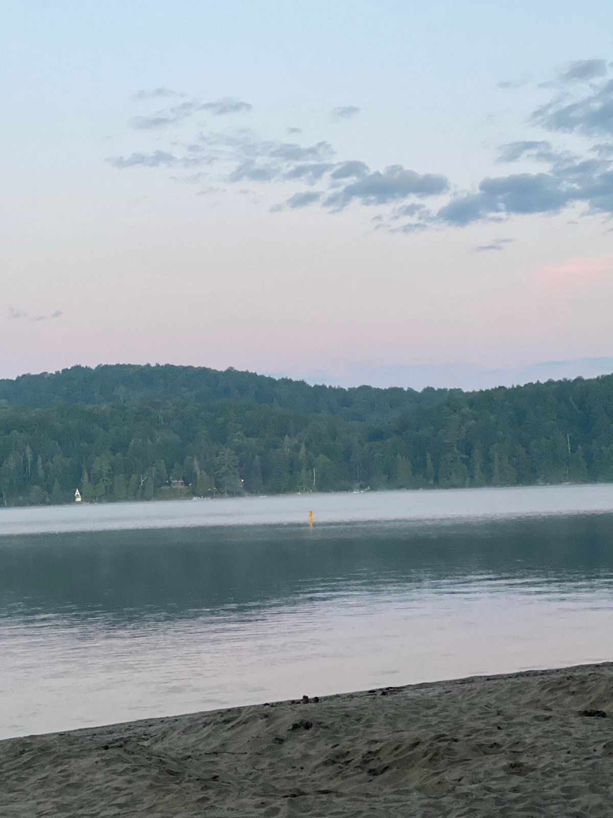 Misty dawn over a calm lake near Duhamel, Canada