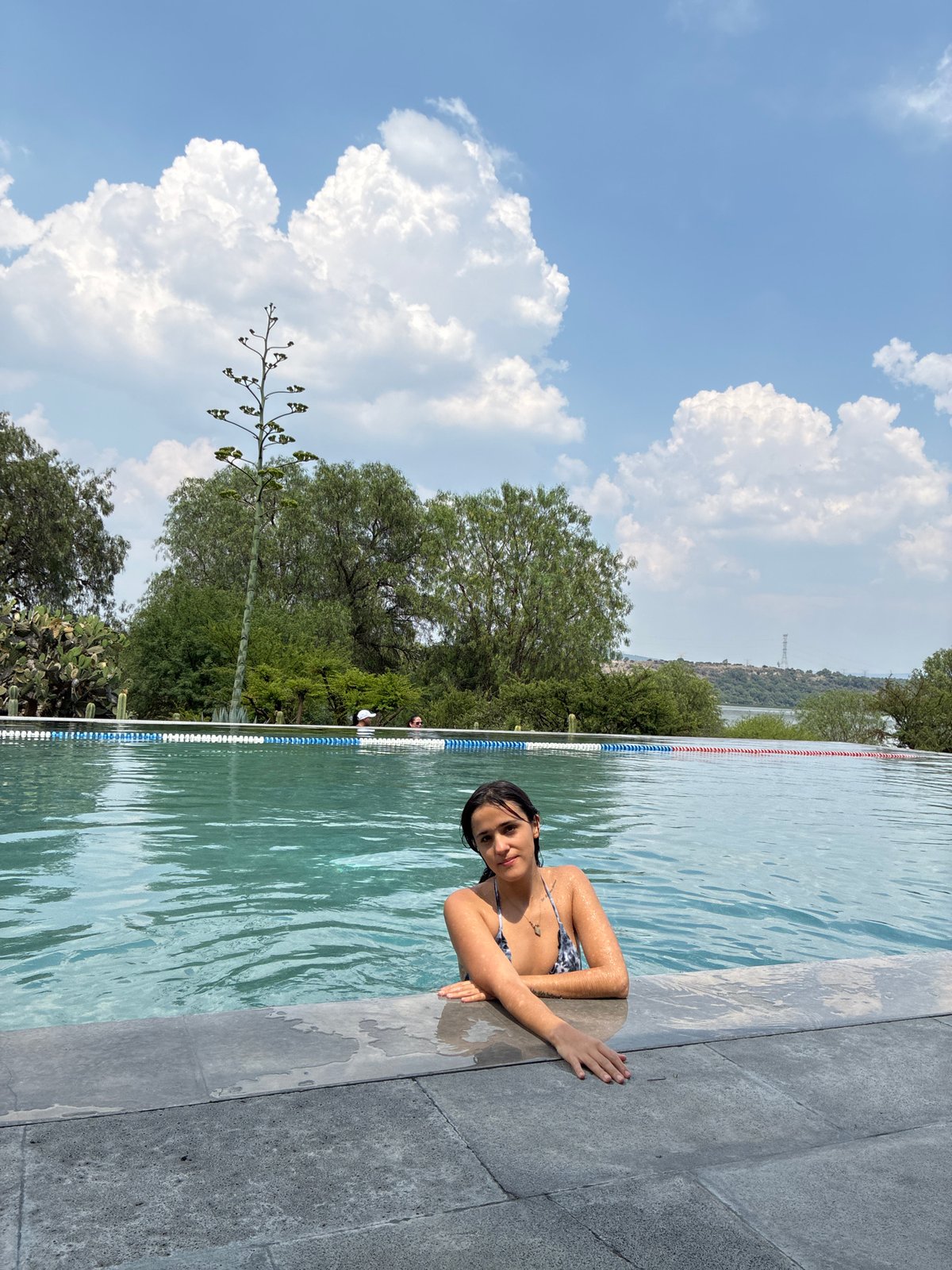 Two women enjoy evening swim in Pueblo Nuevo pool