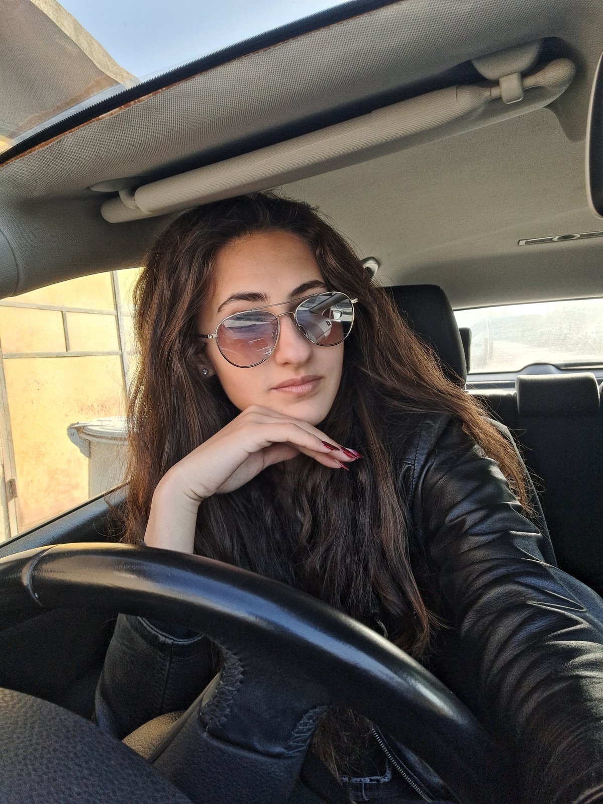 Woman photographed in car during daylight in Chepintsi, Bulgaria