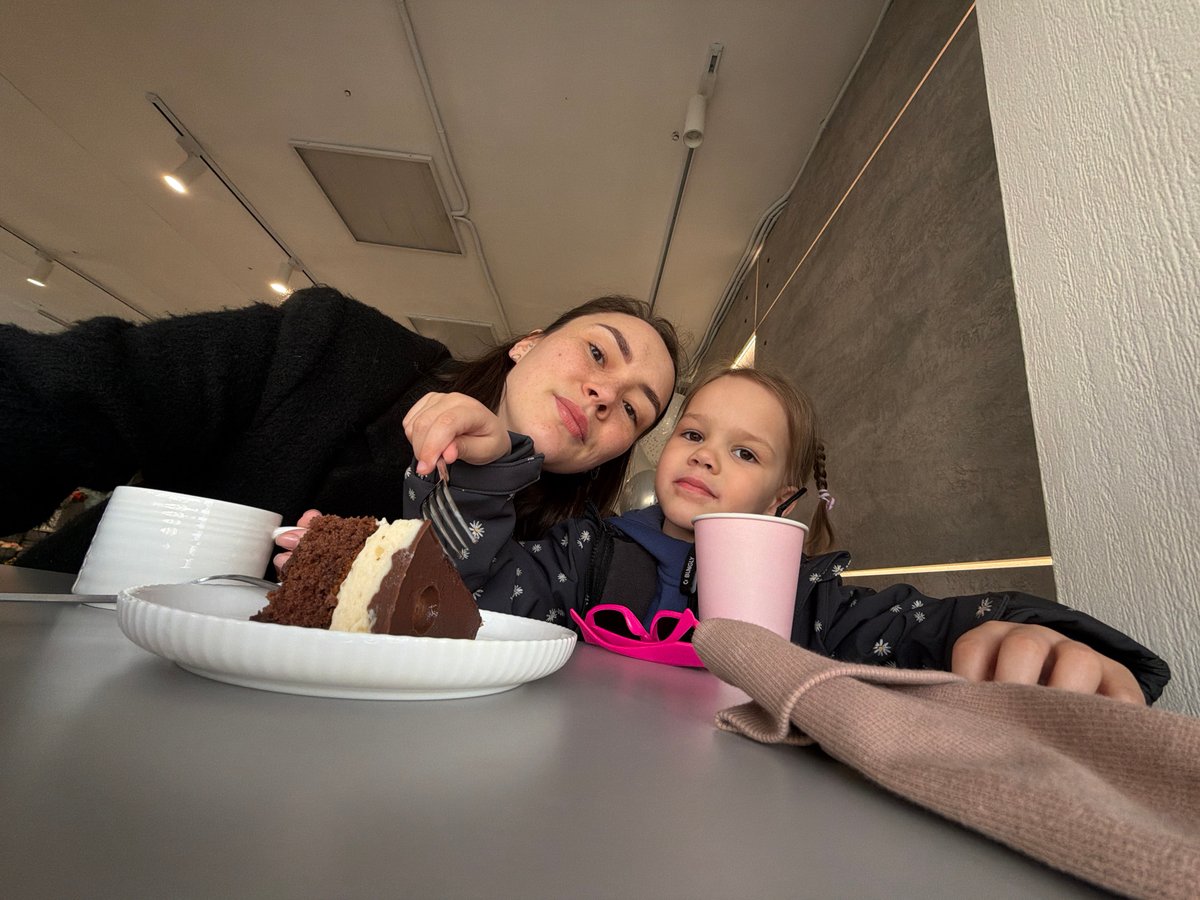 Mother and daughter share cake at Chaikovsky cafe