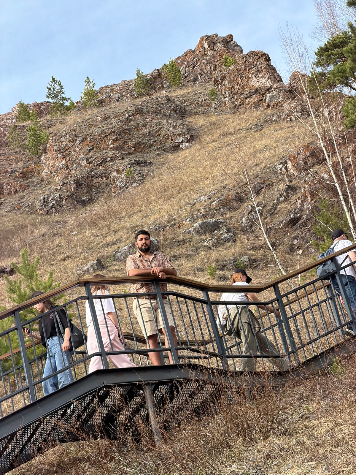 Visitors explore metal observation platform in Krasnoyarsk natural area