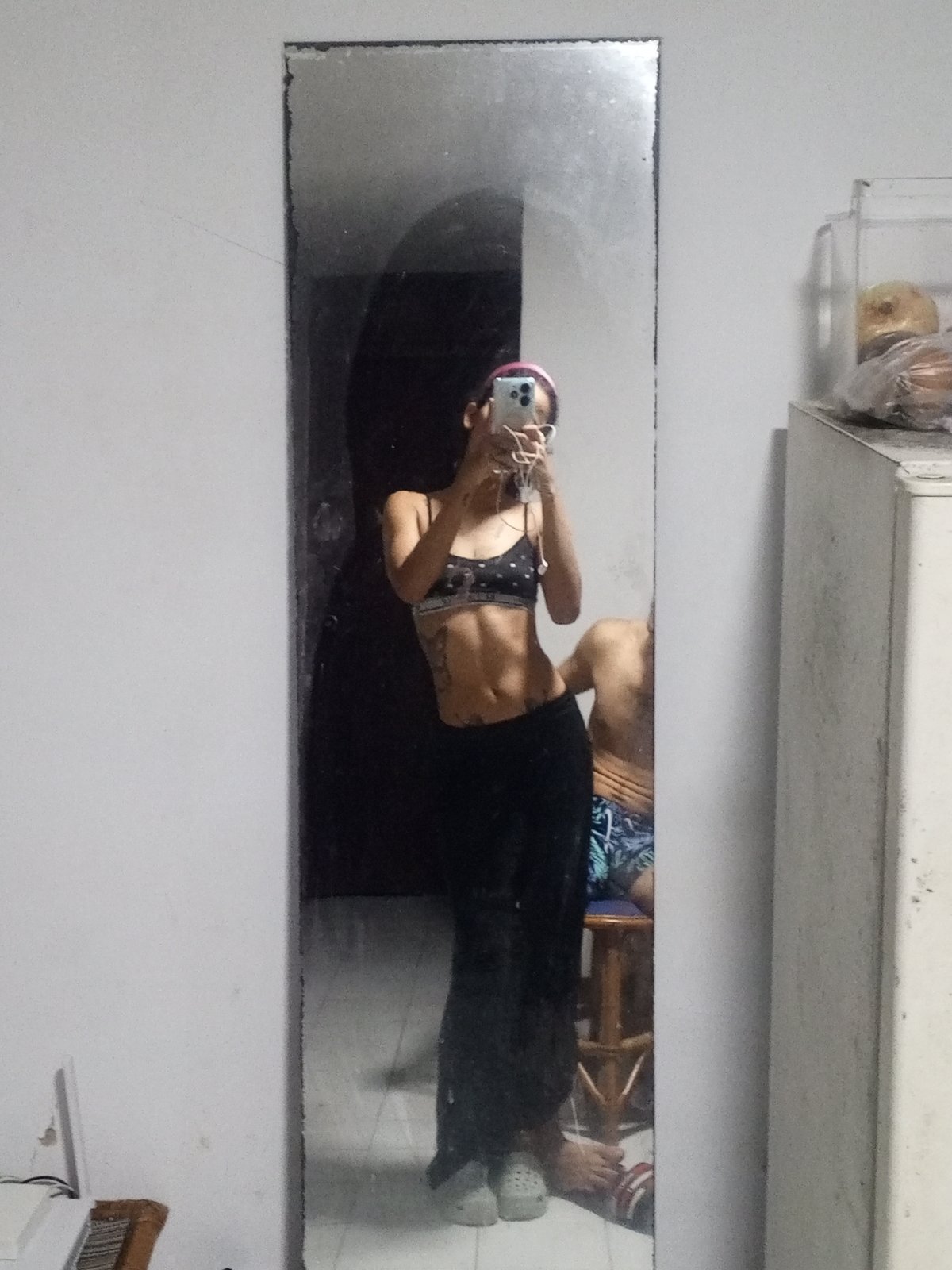 Mirror selfies in Porlamar, casual athletic look with butterfly tattoo
