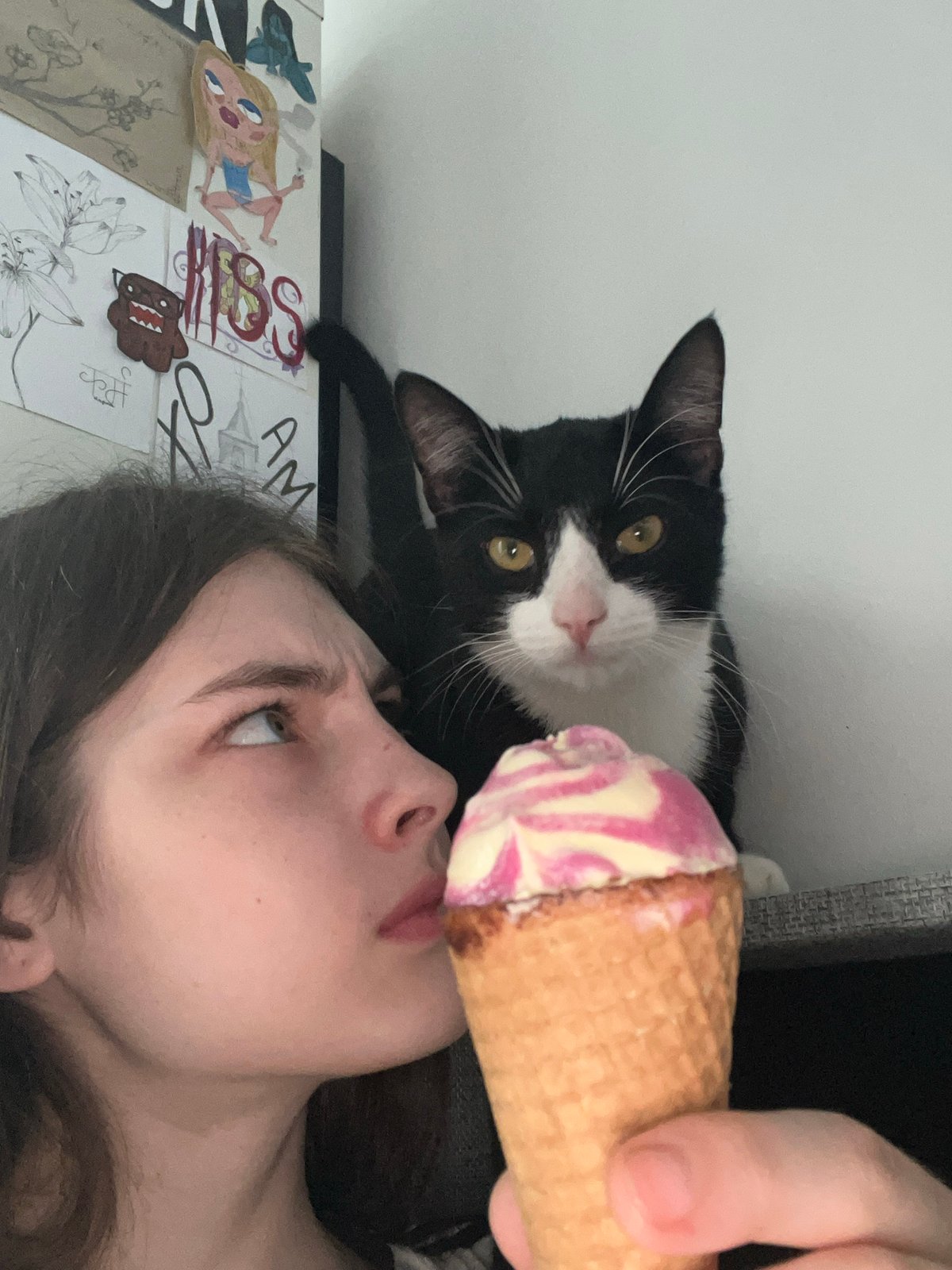 Woman enjoys ice cream and cat time in Saint Petersburg