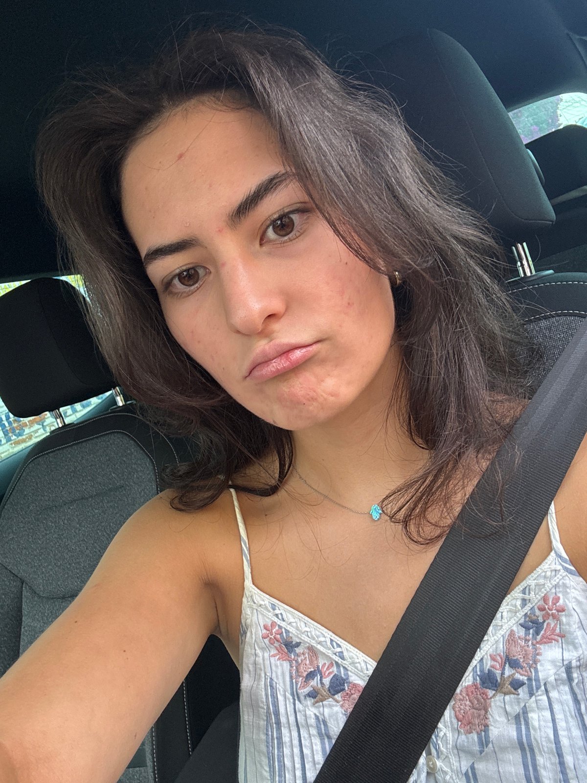 Woman photographed in car during evening drive through Puebla