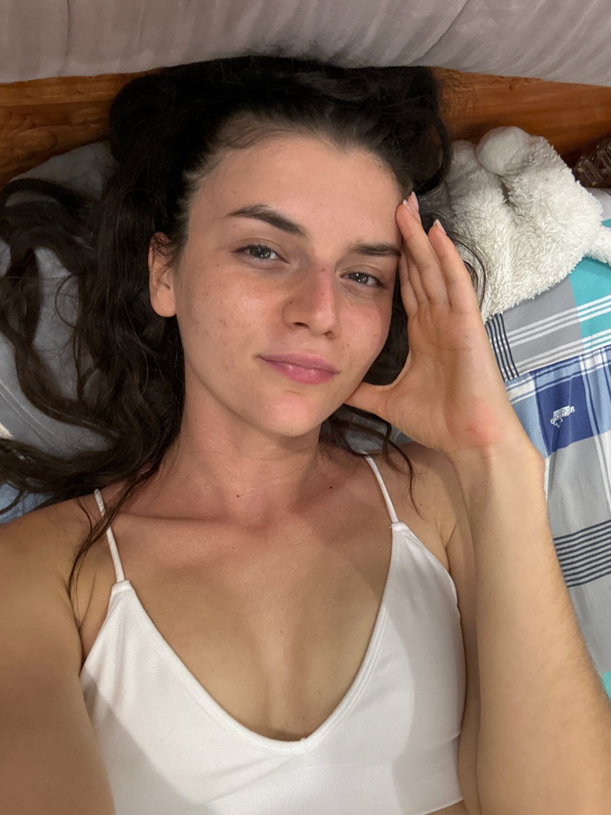 Woman photographed with cat in bedroom in Mũi Né