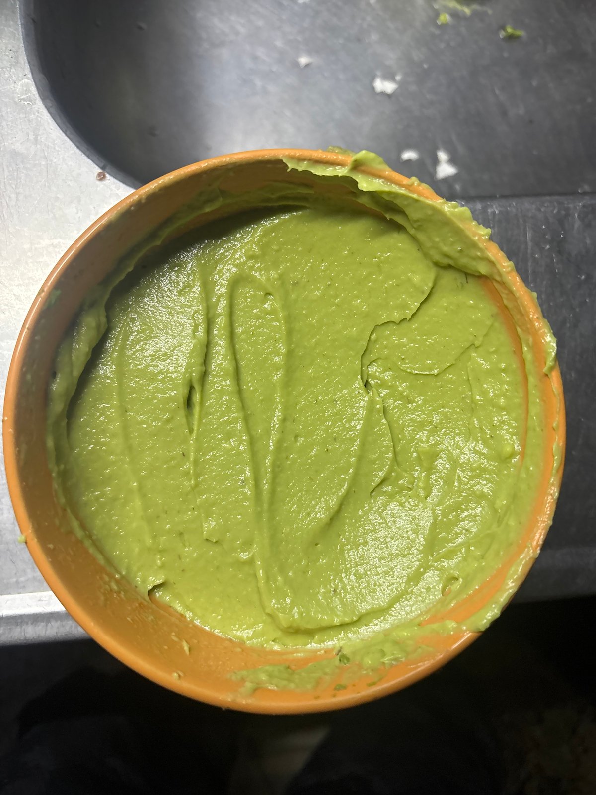 Late-night guacamole preparation captured in Buenos Aires kitchen