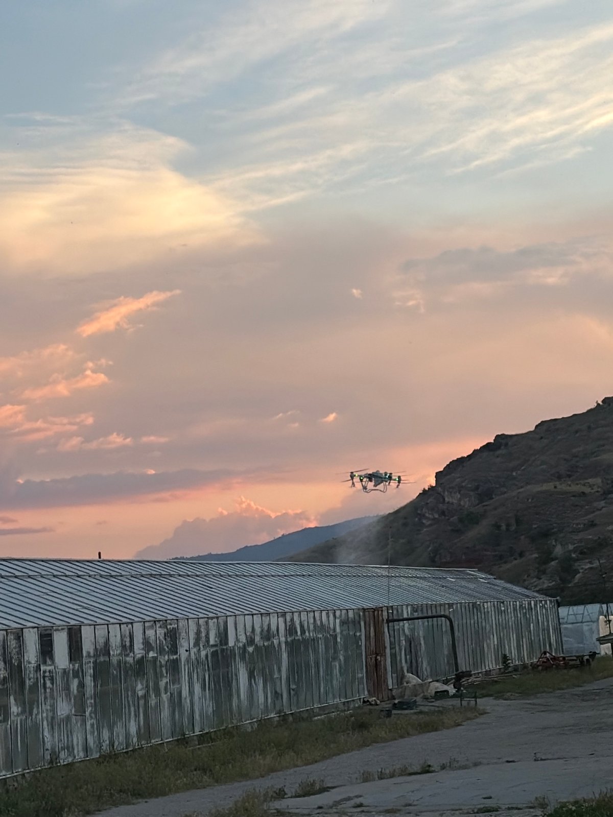 Rural sunset documented with drone presence at unknown location
