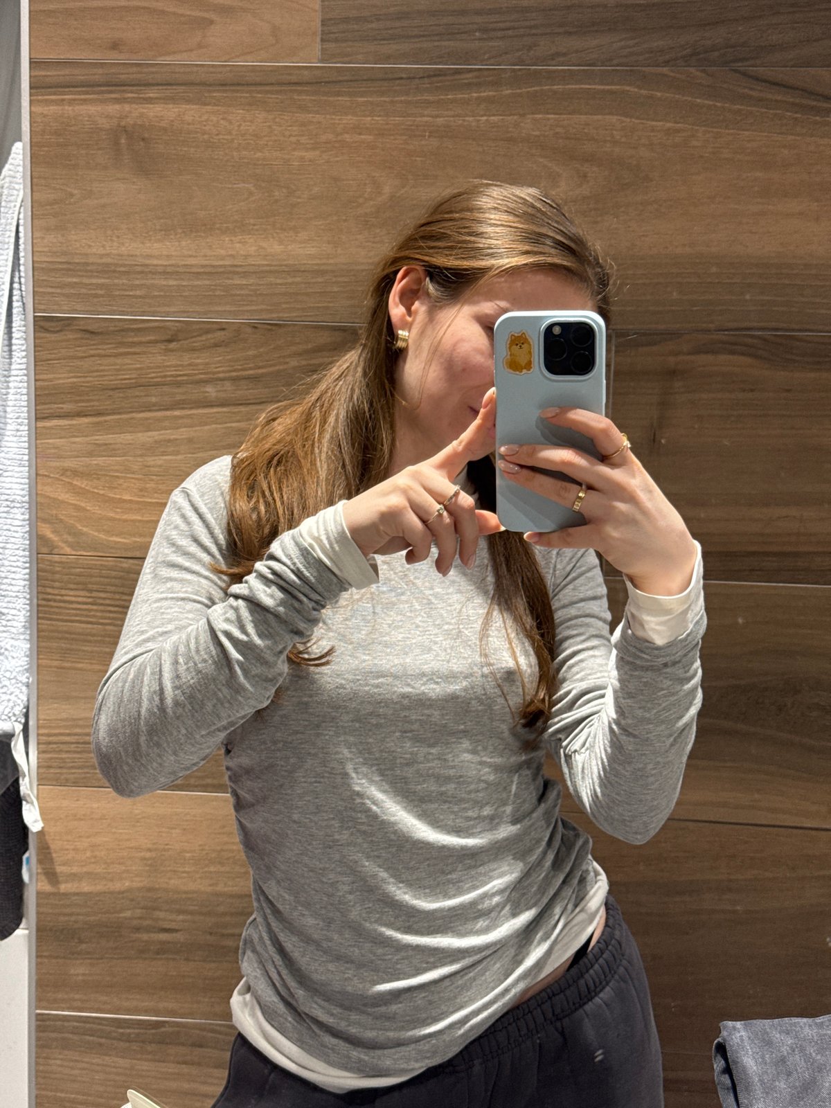 Person takes selfie against wood paneling in Khimki