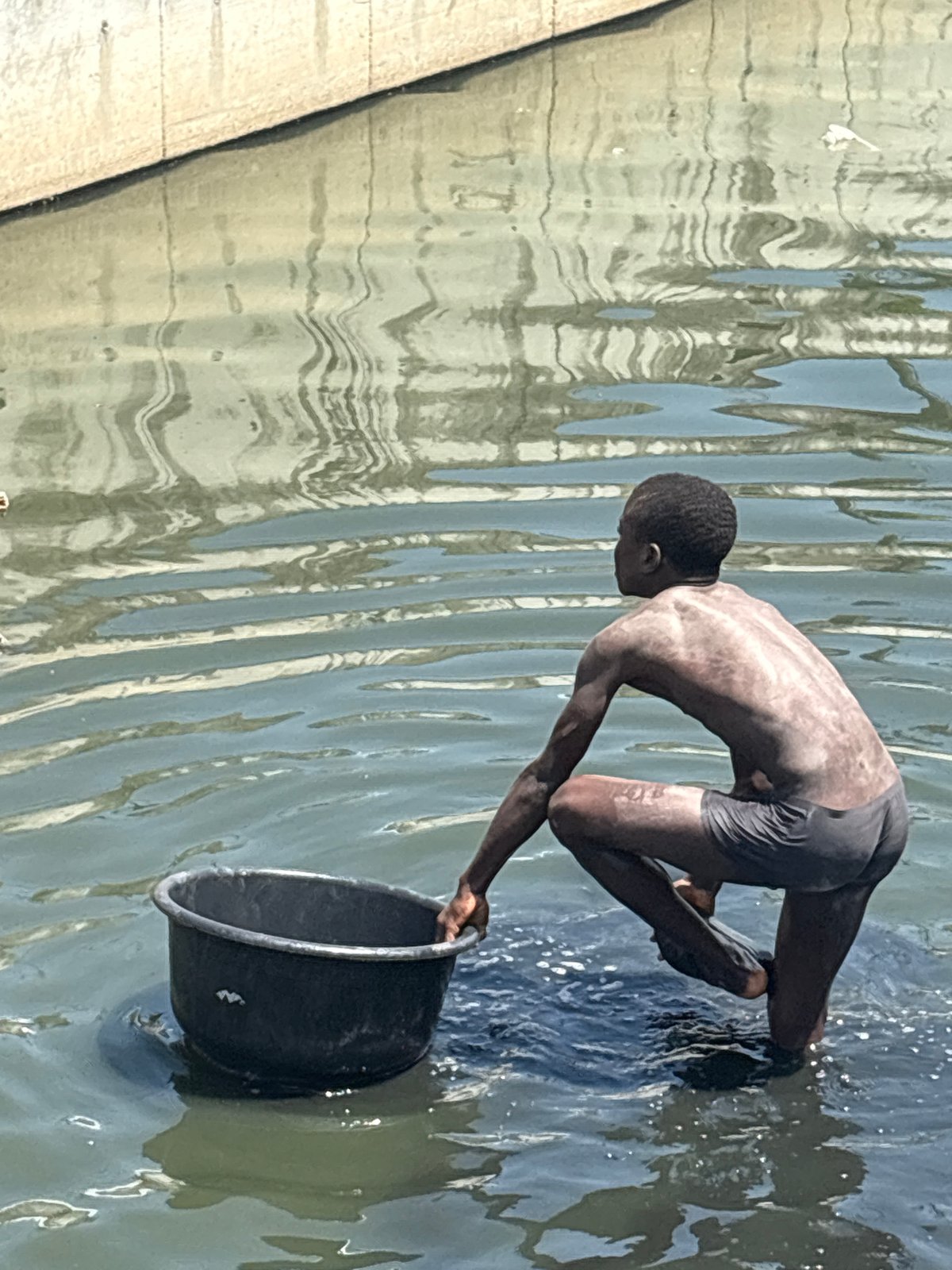 Nigerian children swim and play in local waters