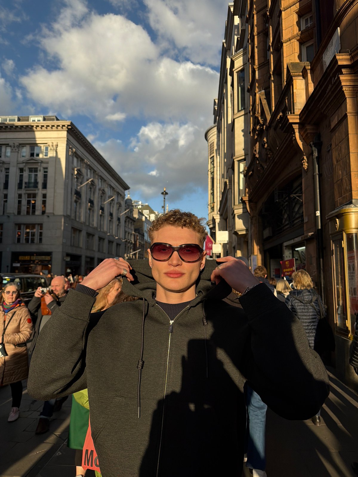 Two men photographed on busy London street