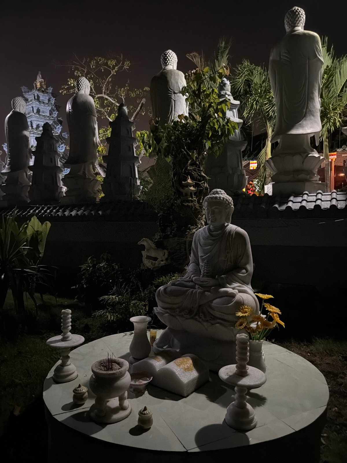Nighttime Buddhist temple ritual setup observed in Đà Nẵng