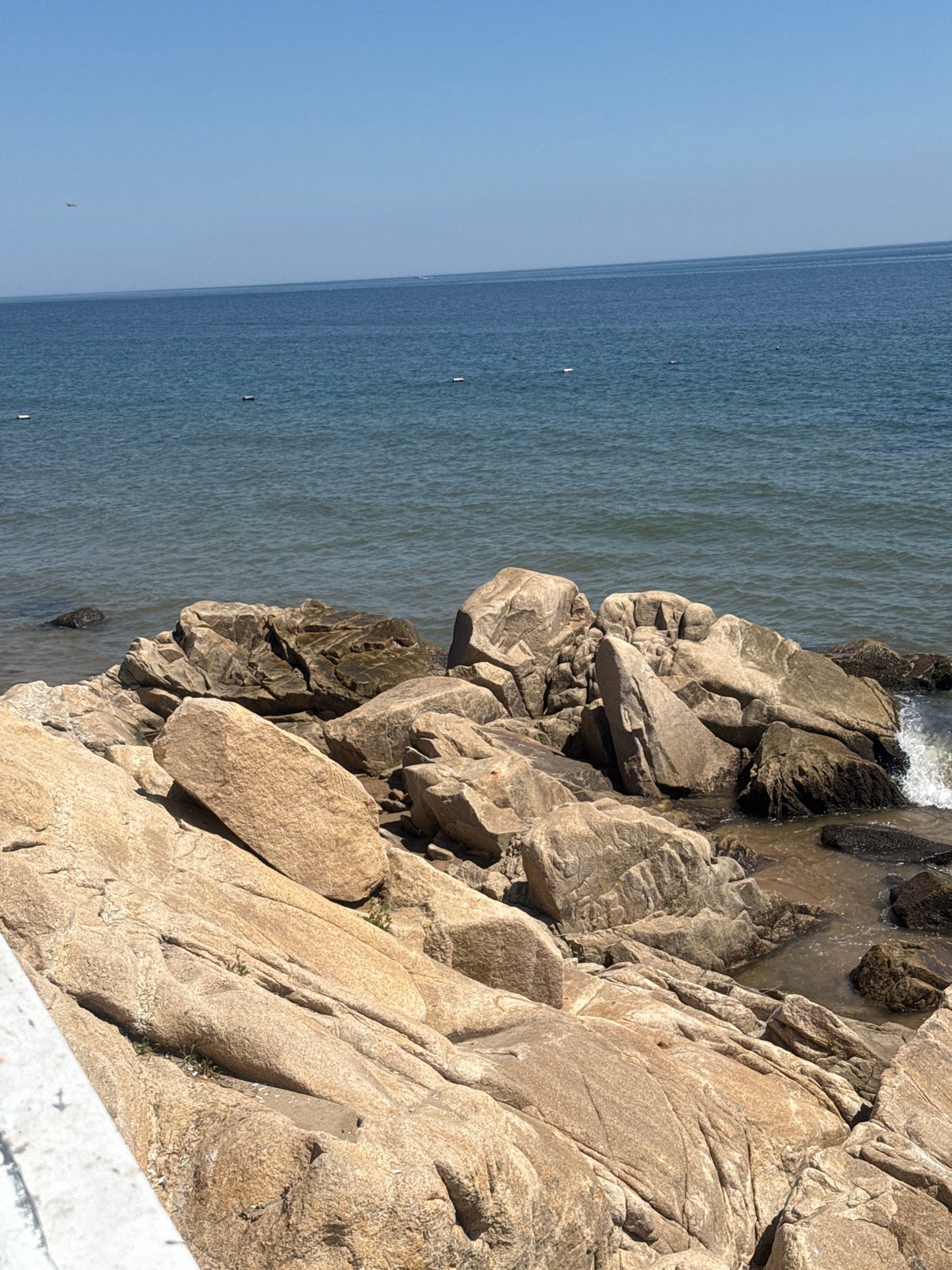 Qinhuangdao coastline: rocky shores, sandy beach, calm sea