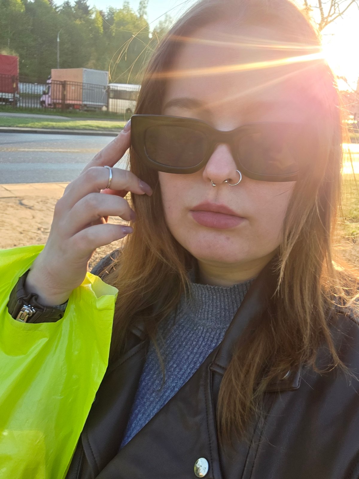 Woman films selfies during early morning outdoor walk