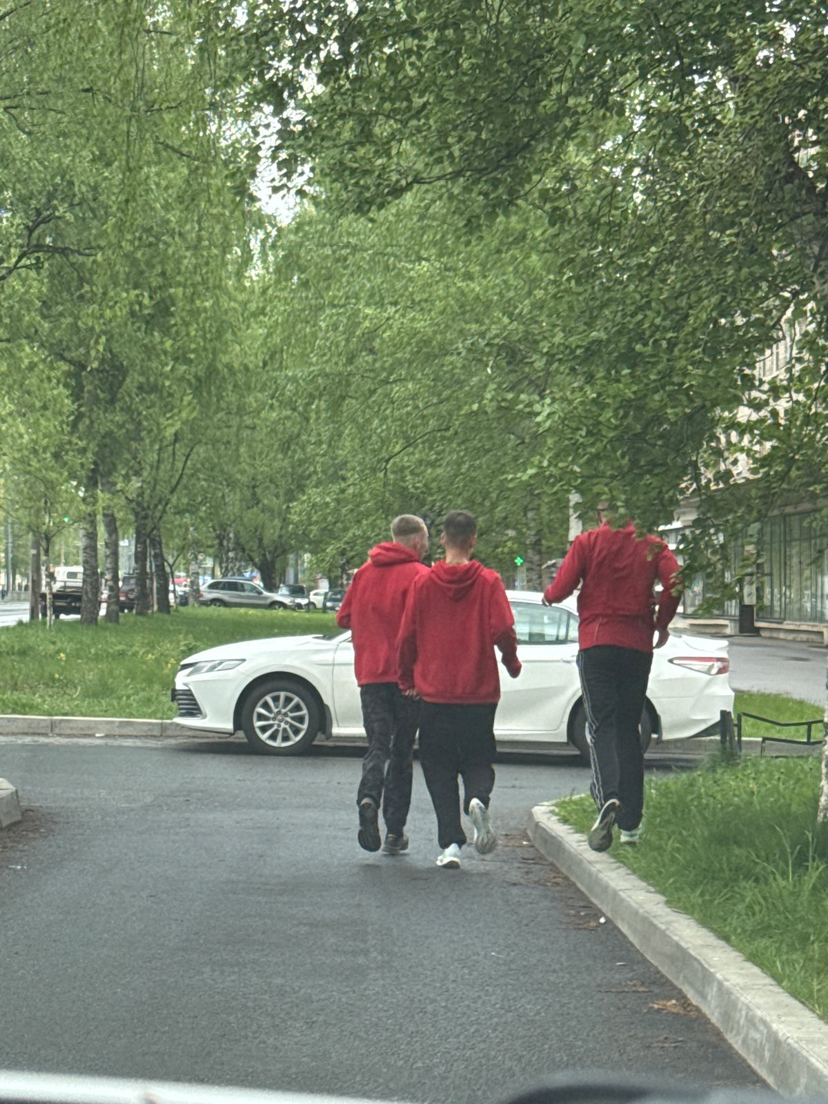 Red-hooded group observed walking, running on St. Petersburg street