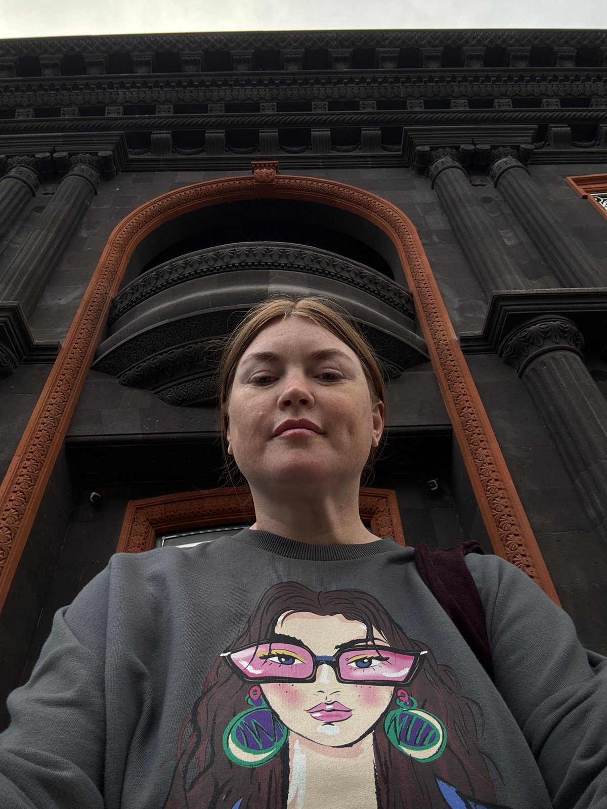 Tourist documents afternoon stroll through historic Gyumri, Armenia streets