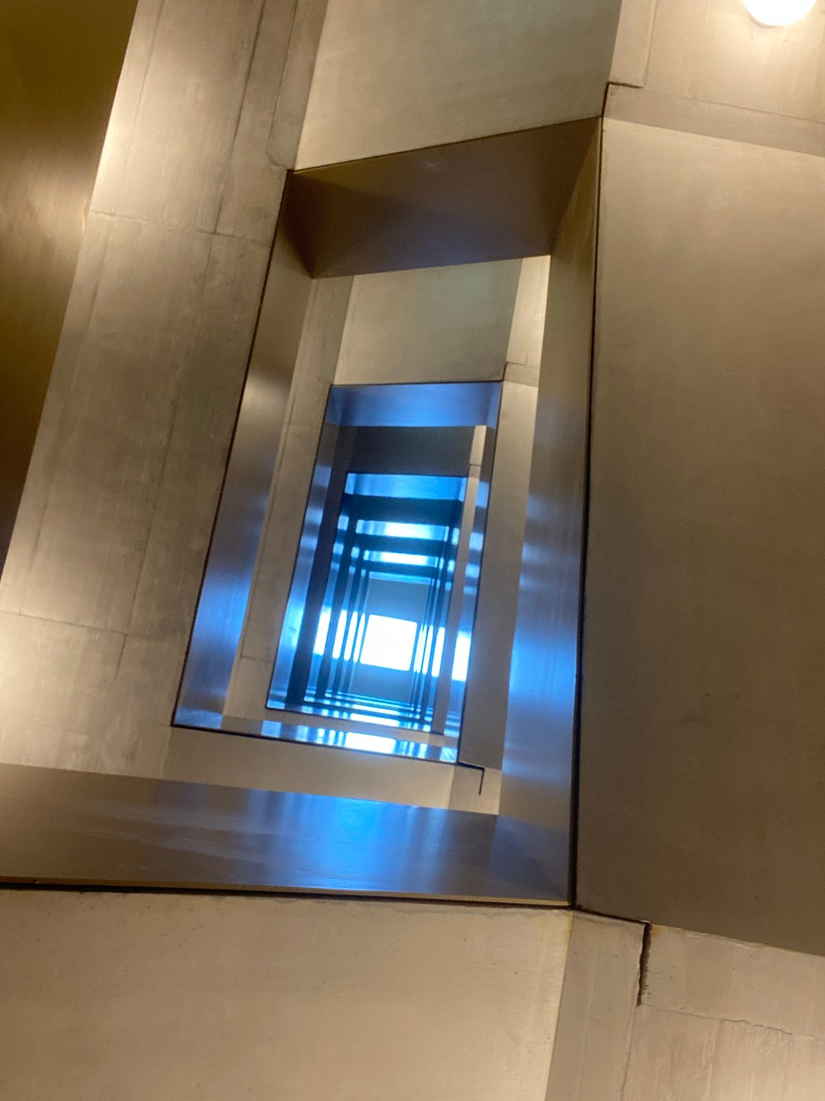 Upward staircase view captured in Kriens, Switzerland