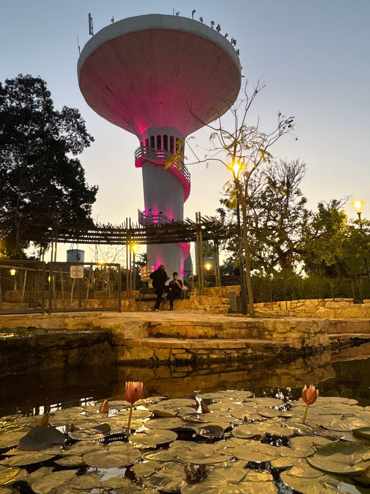 Ramat Gan water tower glows pink in evening display