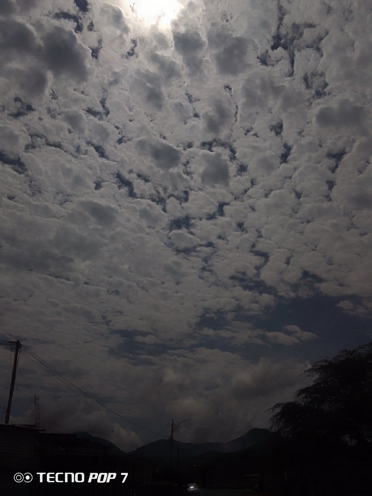 Dramatic cloud formations shift over Altagracia, Venezuela afternoon