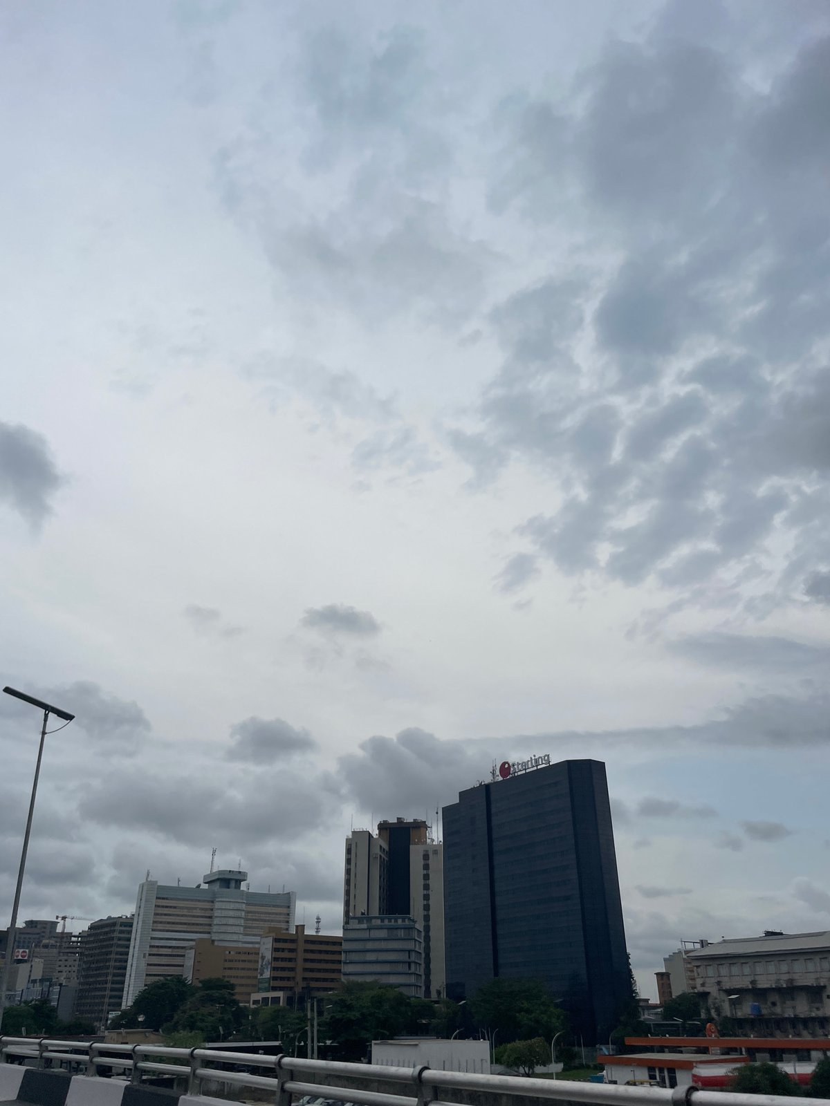 Lagos cityscape photographed showing Sterling building under cloudy skies