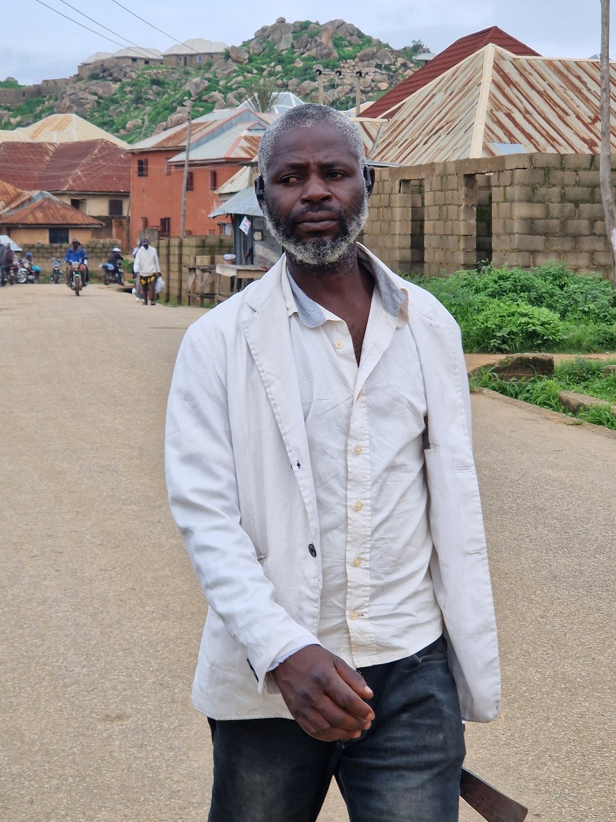 Street life and social graphics from a Jos morning
