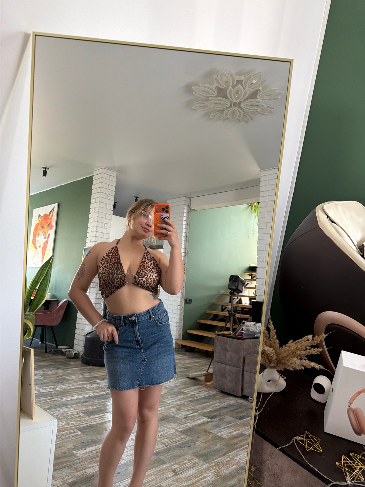 Woman takes mirror selfies in decorated room, Russia