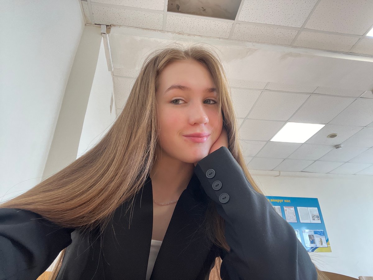 Woman takes indoor selfie in Chaikovsky building