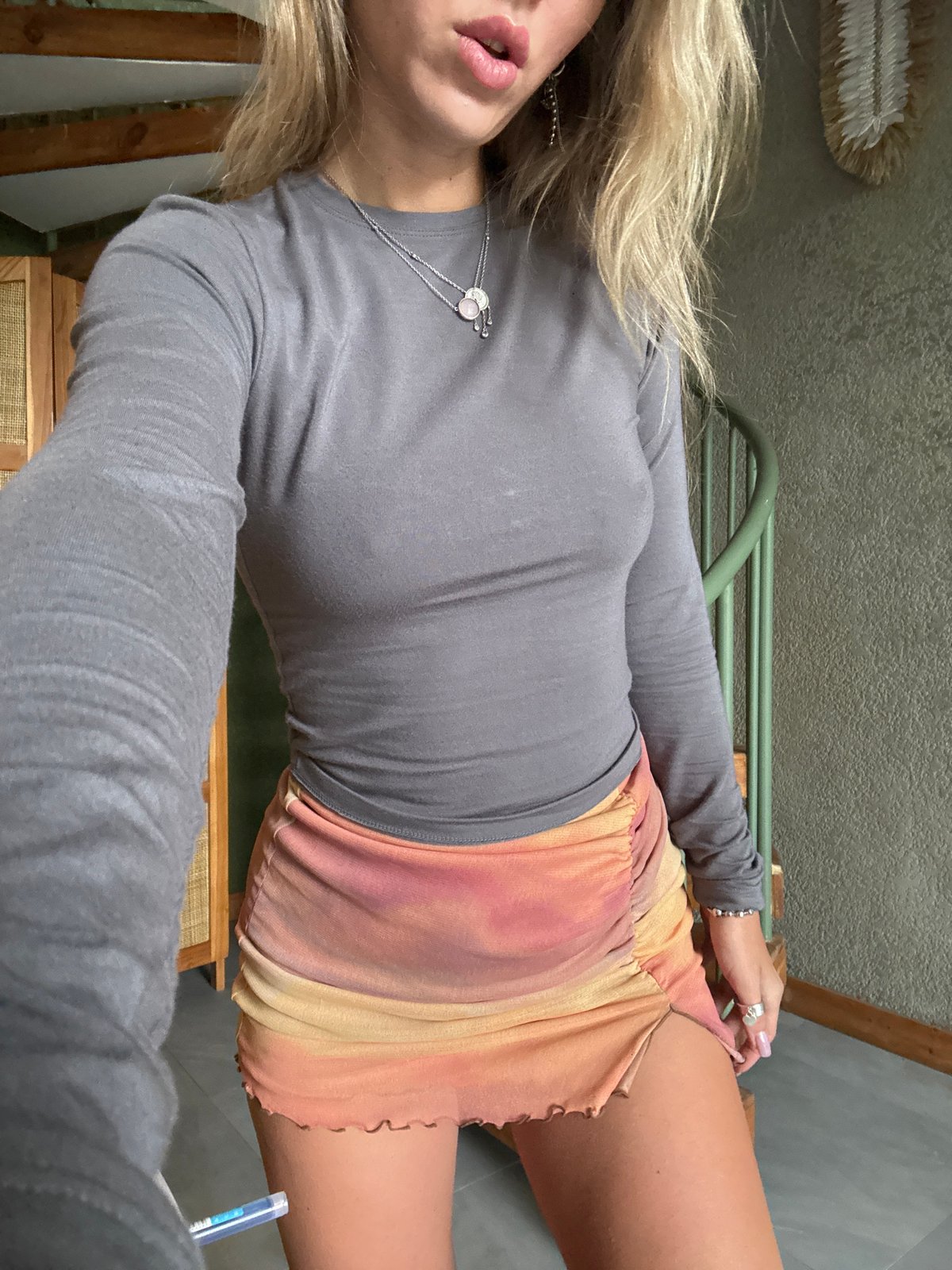 Outfit photo session featuring ruched skirts and a pink bikini top