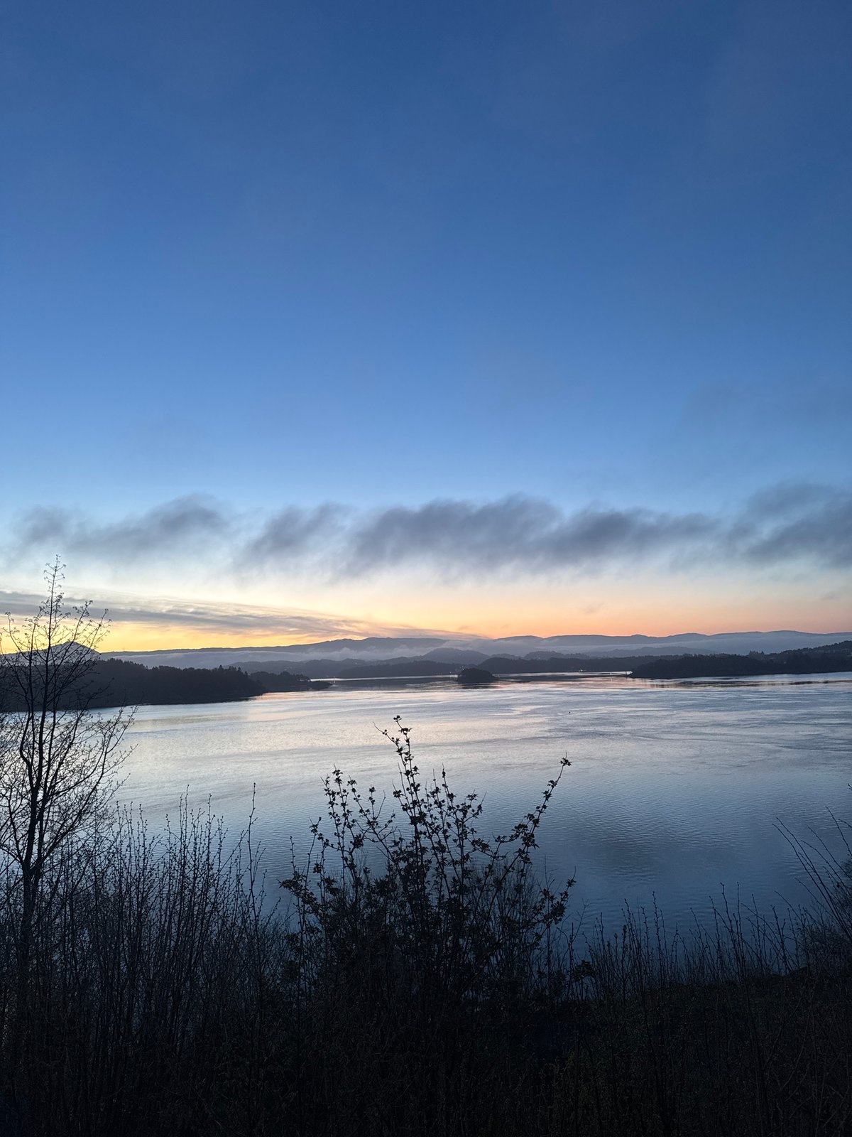 Dawn landscape with colorful sky transition observed in Norway