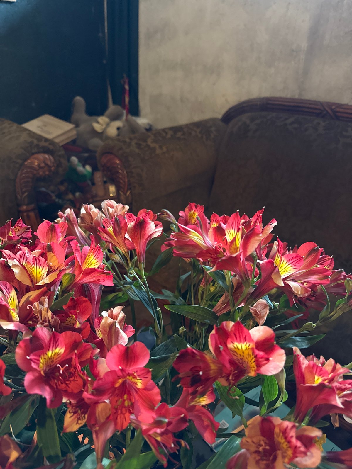 Flowers and sushi documented in indoor setting