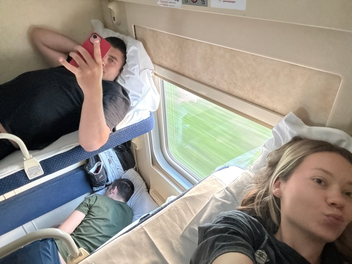 Passengers rest in Moscow train compartment during early morning hours