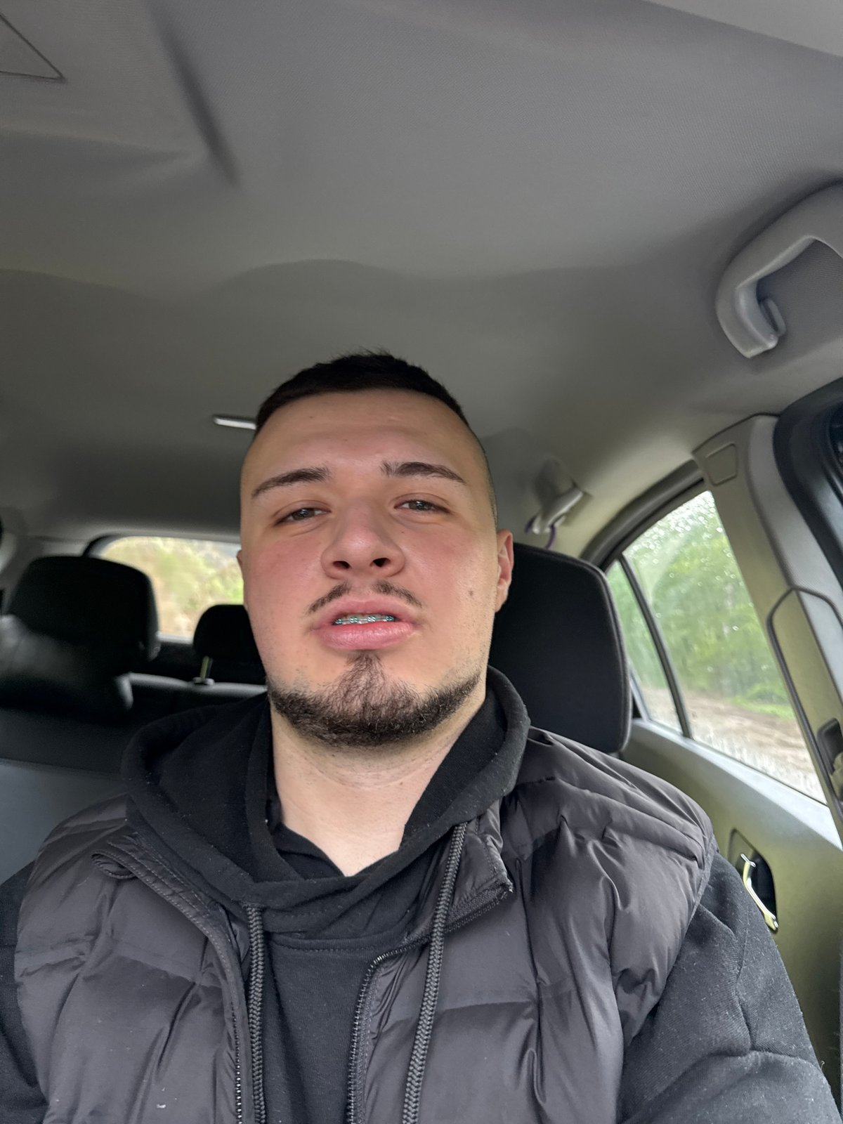 Man in winter clothing observed in vehicle, Smolyan Bulgaria