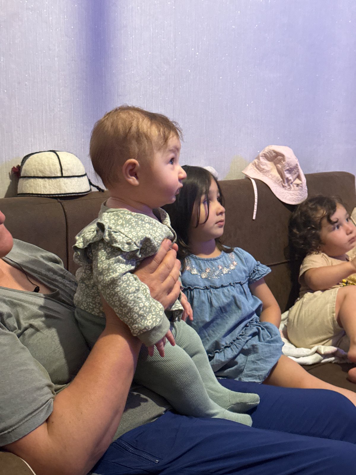 A quiet Georgian evening — kids indoors, animals and headlamps outside