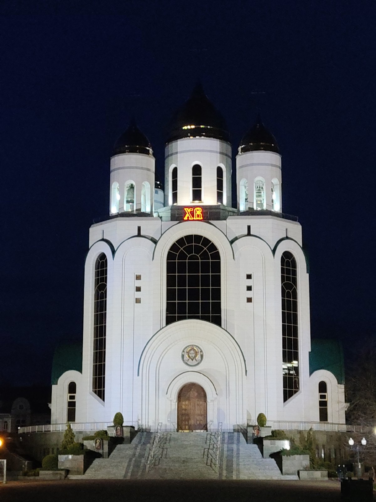 Evening scenes documented across Kaliningrad including cathedral, square, barbershop