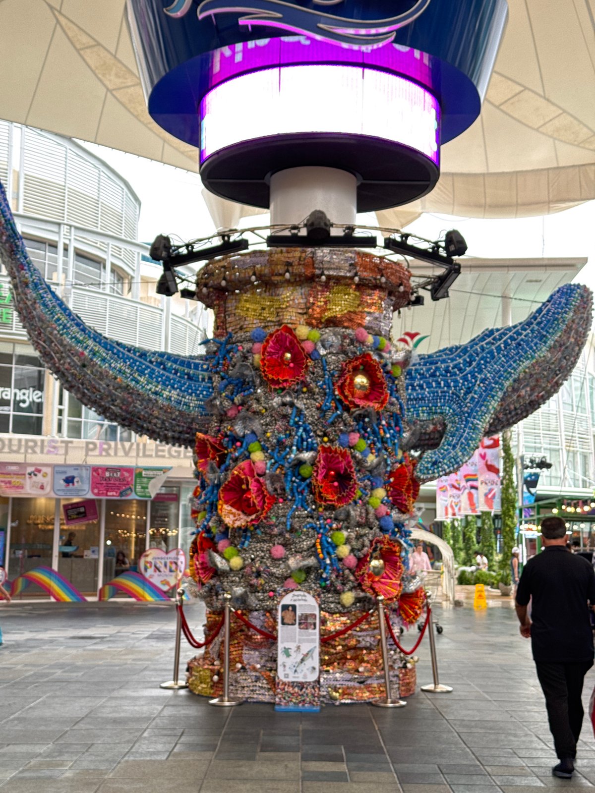 Patong street scenes and a mosaic whale sculpture on a rainy morning