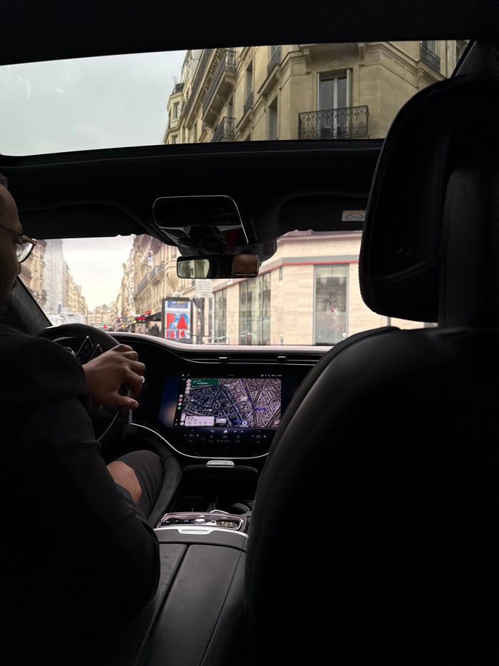 Vehicle interior documented from passenger perspective in Paris