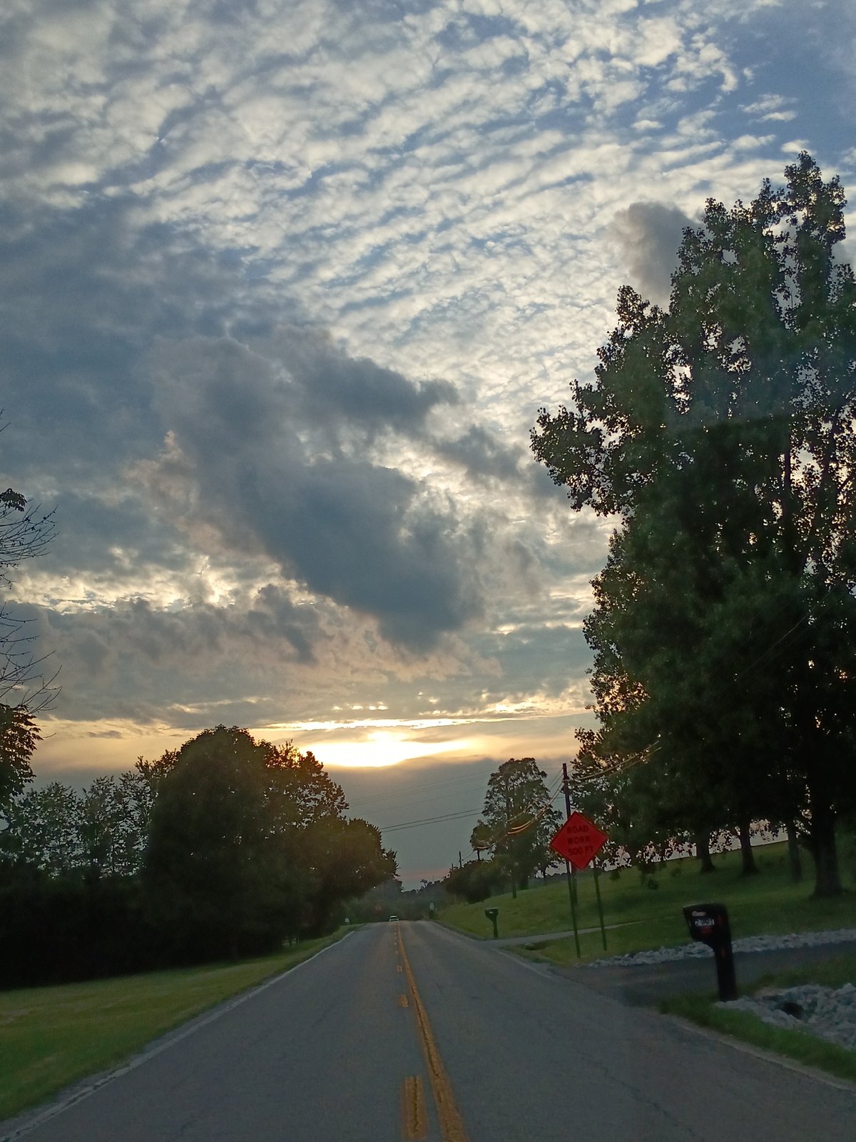 Warm sunset light over a quiet rural road in Kentucky