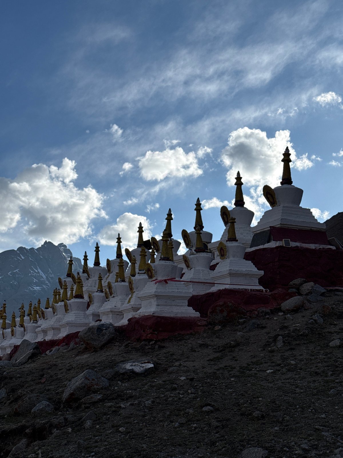 Buddhist stupas with golden spires documented in mountainous China