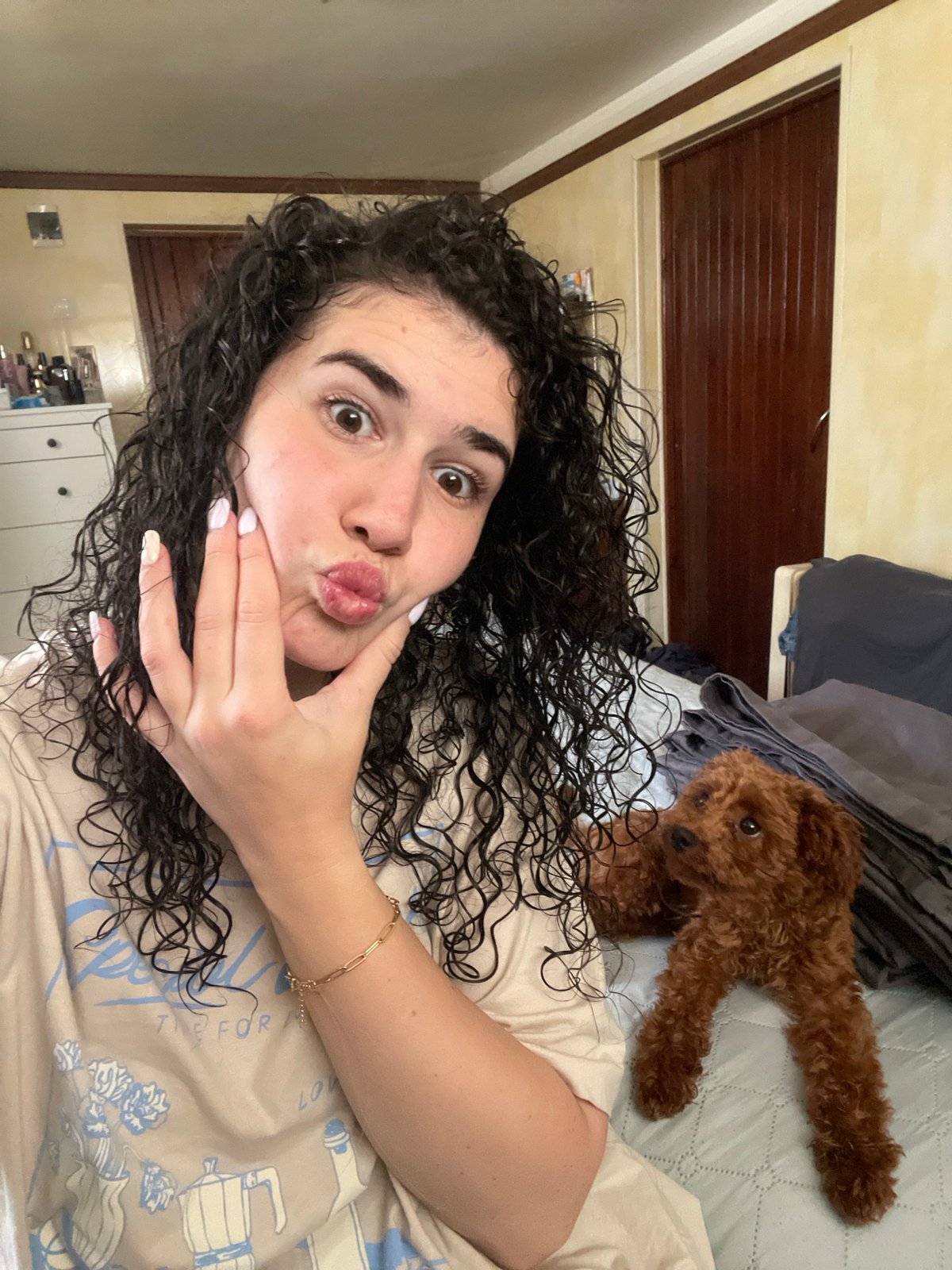 Woman and curly-haired dog share afternoon moments in Sofia