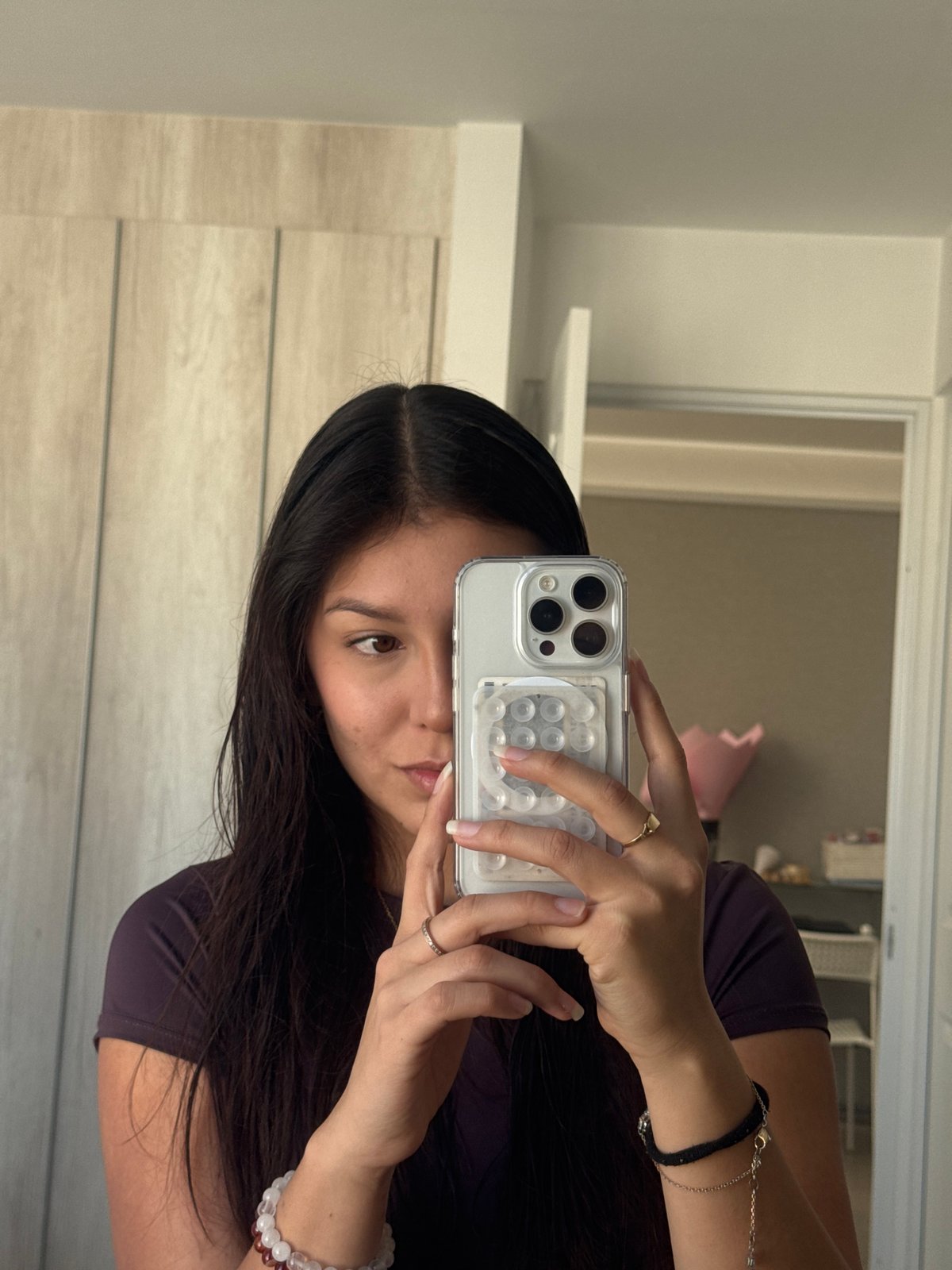 Woman takes selfies in Mexican town, mountain visible