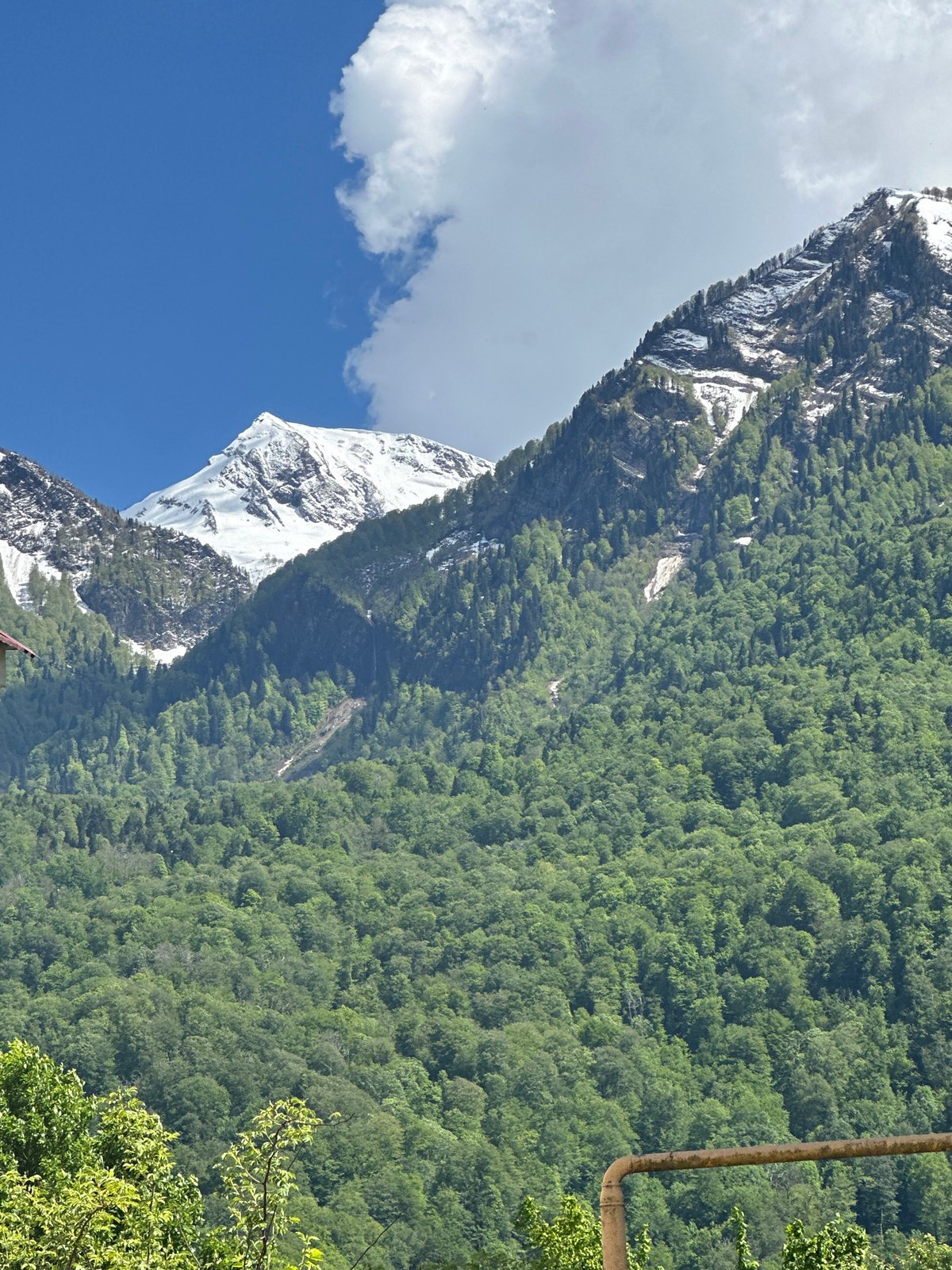 Person walks through scenic Krasnaya Polyana mountain resort