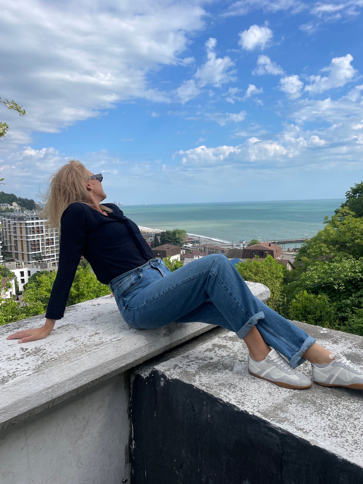 Woman enjoys scenic moment on Dagomys overlook