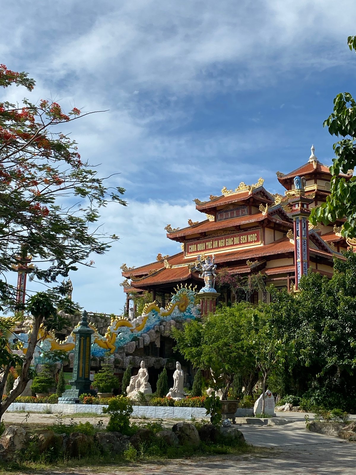 Morning at a Da Nang Buddhist temple complex with lotus ponds