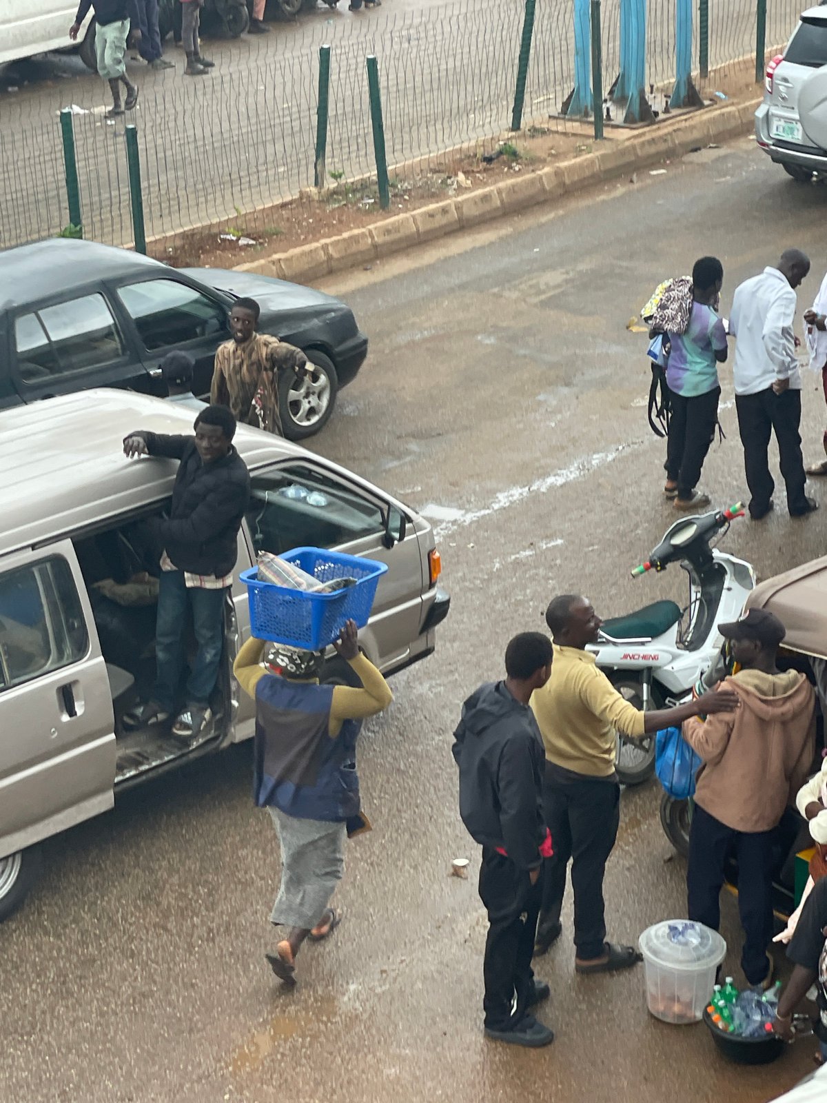 Street market in full swing — vendors, shoppers, and foot traffic