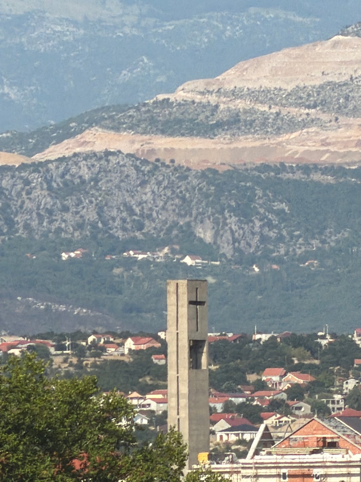Podgorica rooftops and mountains, framed from above